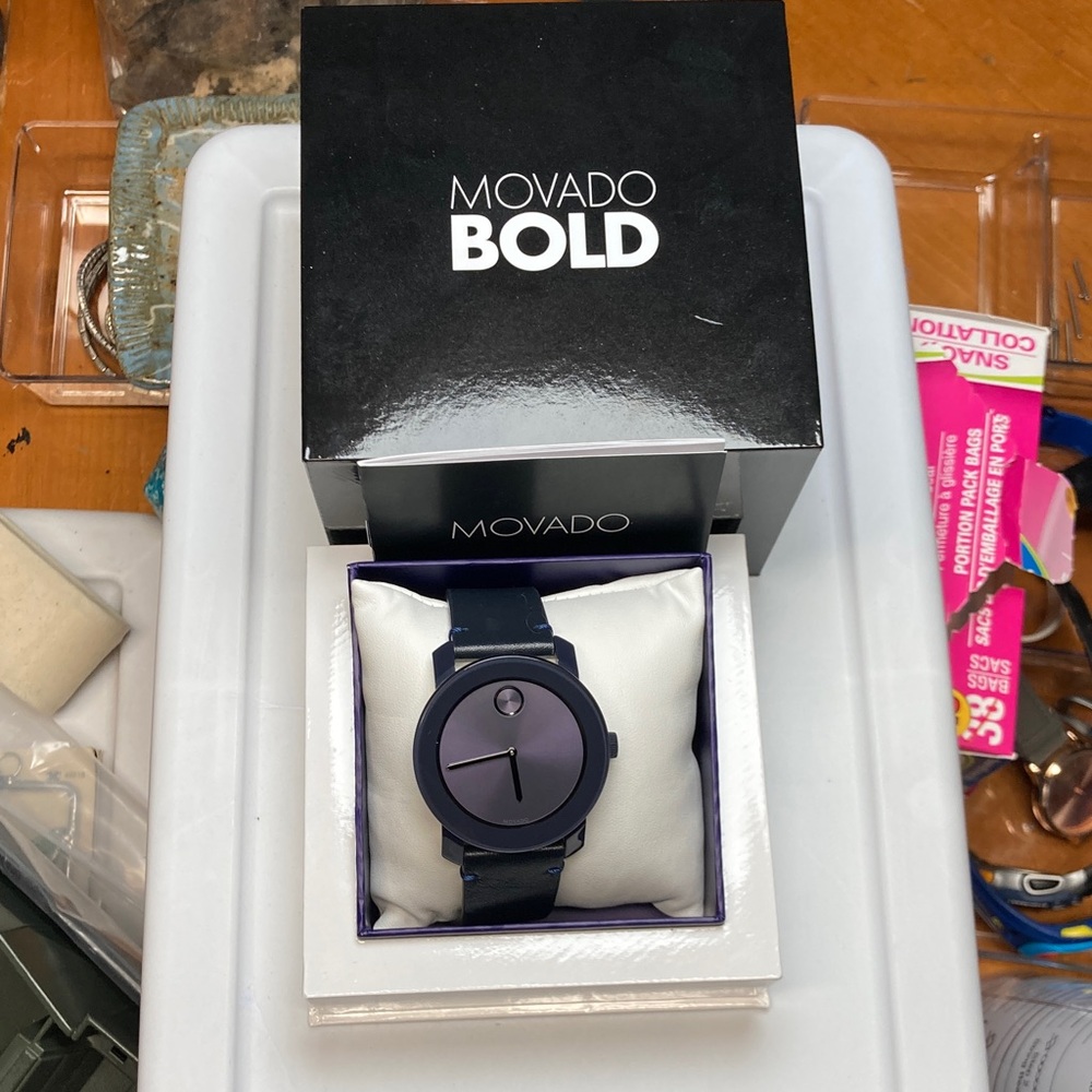 Movado Bold watch, grayish blue color, leather strap, new battery